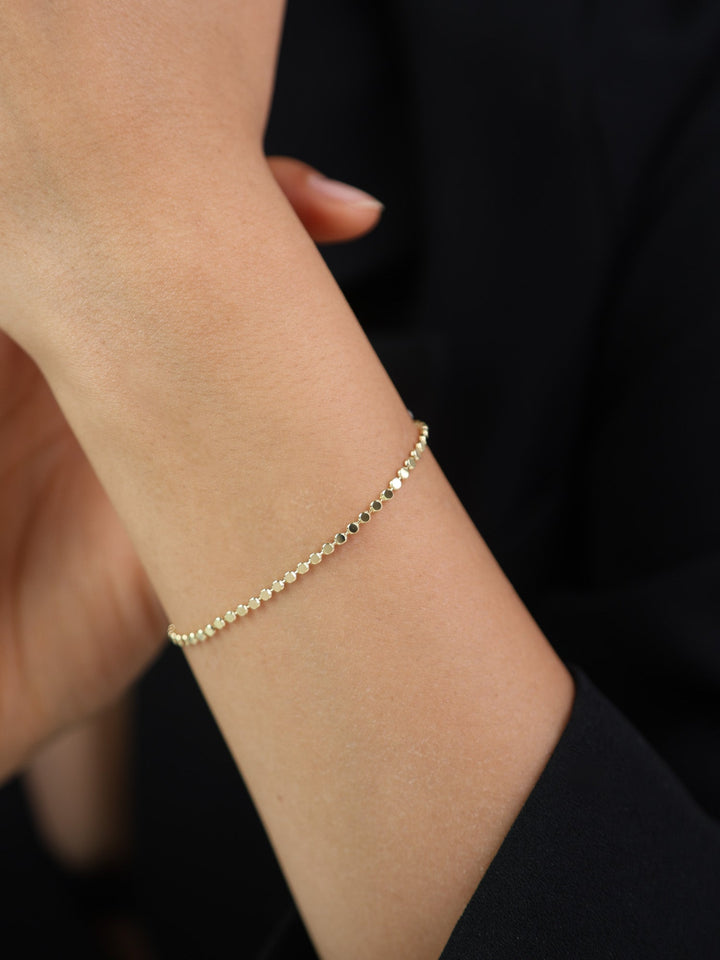 Pulseira de bolinhas banhada a ouro