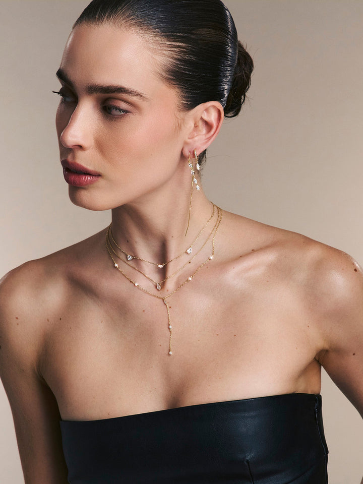 Pendentes banhados a ouro com zircónias transparentes